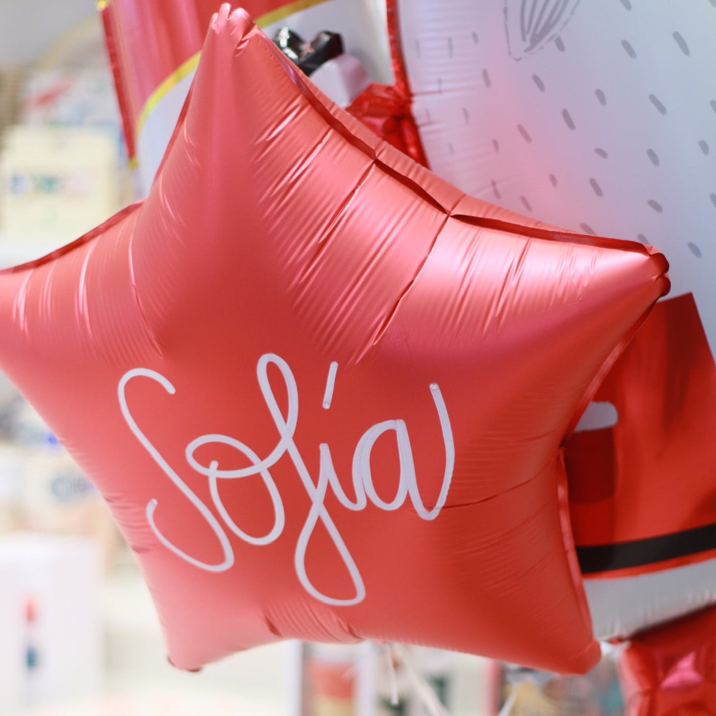 Personalized BASIC star balloons inflated with helium