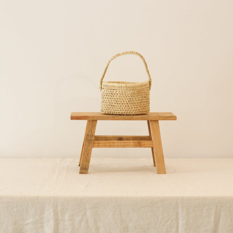Handwoven long handle raffia basket