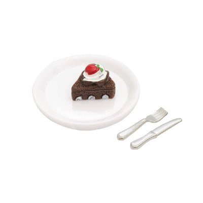 Bolo de chocolate em miniatura com prato e talheres 