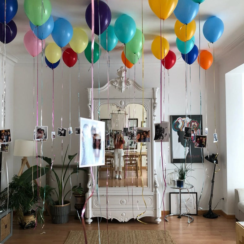 Multicolored ceiling balloons inflated with helium