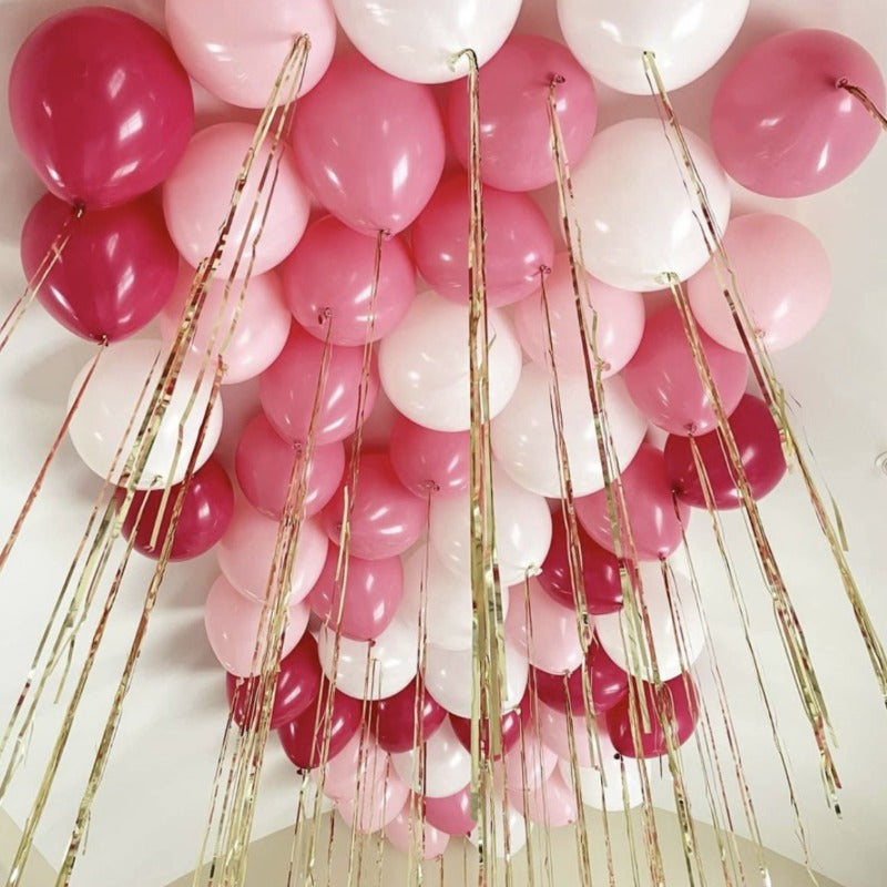 Balões de tecto em tons rosa com fitas de alumínio insufladas com hélio <br> (apenas Barcelona e Madrid)