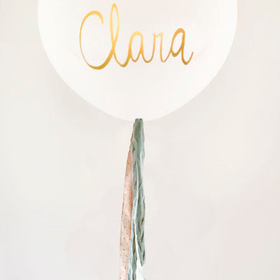 White Bio Latex L balloon inflated with mint and stone fabric and Lettering